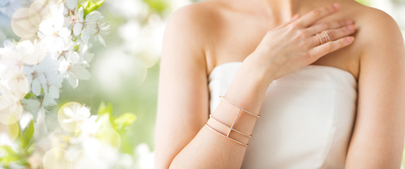 close up of beautiful woman with ring and bracelet
