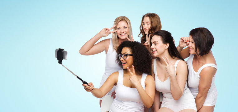 group of happy women taking selfie by smartphoone
