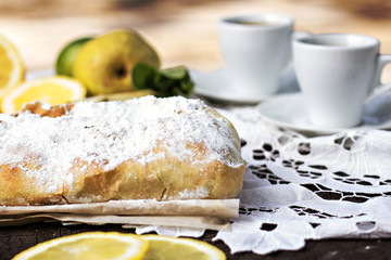 pie, strudel with pear and lemon. Cup of coffee. .Picnic, Breakfast in nature. Food in nature.
