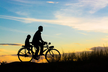 Biker family silhouette father and son