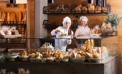 Poster Bakery staff offering bread © JackF