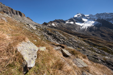 trekking in the Italian Alps; it's autumn with no people around