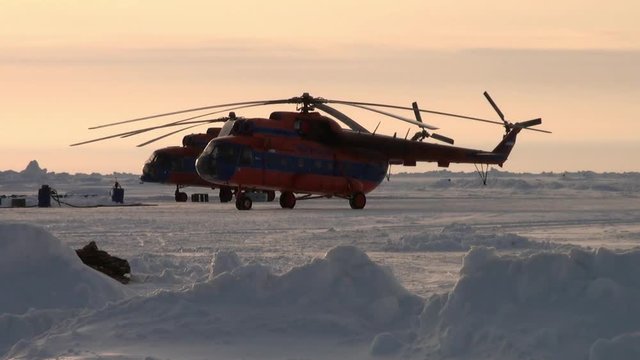 Take off the helicopter with ice airfield. ICE CAMP BARNEO, ARCTIC - APRIL, 2010:  Drift station on frozen Ocean near North Pole. With its integrated ice runway, caters for air borne tourist industry.