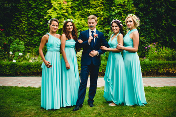 Handsome groom and pretty bridesmaids