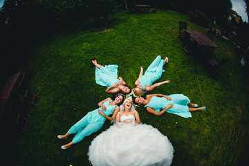 Bride and bridesmaids in beautiful dresses