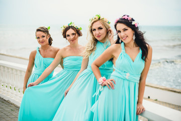 Bridesmaids on the seaside in blue dresses