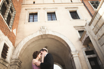 Bride and groom in an old town - wedding couple