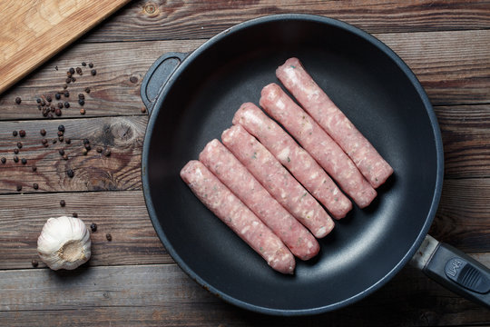 Raw Sausages in a Pan