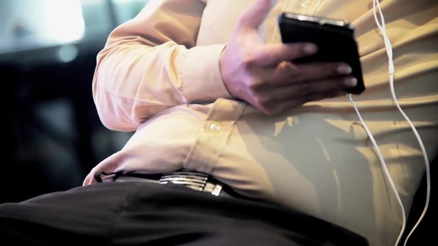 Unknown Old Fat western male use smartphone with touch screen to chat and contact people full HD