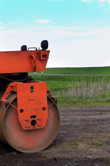 road construction, asphalt compactor. vertical background