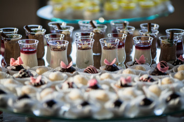 Luxury cakes on wedding dessert table in restaurant