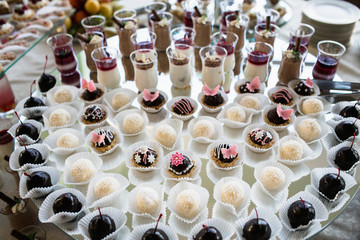 Luxury cakes on wedding dessert table in restaurant