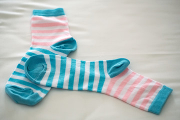 Striped socks on beige backdrop