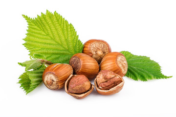 hazelnuts with leaves on white background