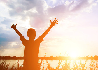 kid silhouette,Moments of the child's joy. On the Nature sunset