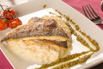 Grilled trout with risotto, tomatoes, and pesto