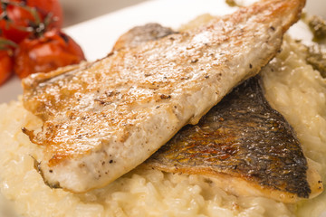 Grilled trout with risotto, tomatoes, and pesto