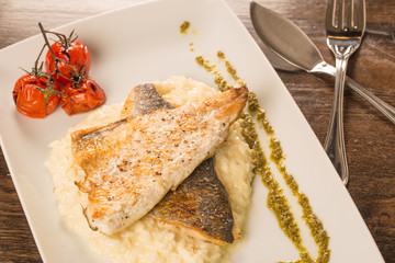 Grilled trout with risotto, tomatoes, and pesto