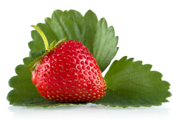 Single whole strawberry with leaf isolated on white