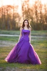 Fototapeta premium Attractive girl at sunset