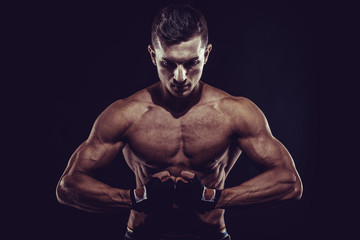 Fototapeta na wymiar MMA Fighter Preparing Bandages For Training