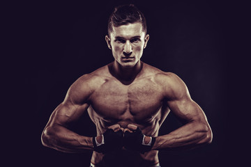 Fototapeta na wymiar MMA Fighter Preparing Bandages For Training