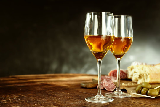 Two glasses of sherry with tasty tapas