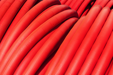 Tubing. Red plumbing pipe close-up.