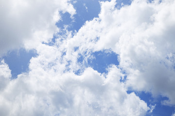 Bright blue sky with clouds closeup
