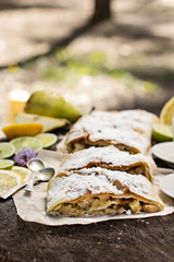 Fototapeta na wymiar pie, strudel with pear and lemon. Cup of coffee. .Picnic, Breakfast in nature. Food in nature.