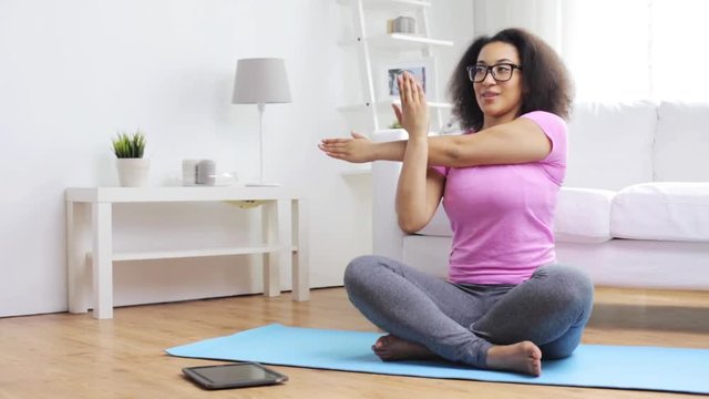 Happy African Woman Exercising On Mat At Home