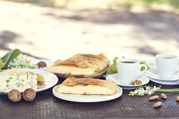 Сheese pie, strudel with cheese, cheese pie 4. Wine, grapes, nuts, cheese, blue cheese, and coffee. dinner, lunch, romantic date, picnic, eating on nature.