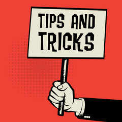 Poster in hand, business concept with text Tips and Tricks