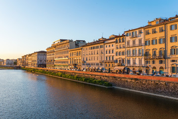 Houses along the river Arno in Florence by evening light