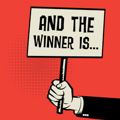 Poster in hand, business concept with text And the Winner is...