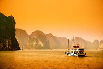HALONG bay in sunset in vietnam. UNESCO World Heritage Site. This view from TiTop island and its most popular view for travel in Halong bay.

