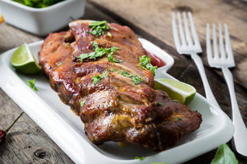 Grilled pork ribs with herbs