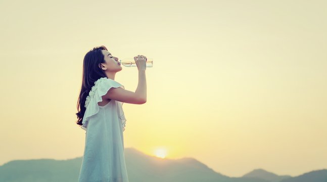 Woman drink water for thirst