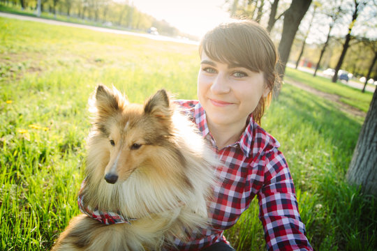 Young Woman Taking Selfie With Her Dog