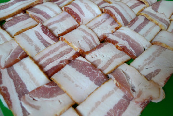 Bacon wrap, woven or weave, raw, for cooking, angled photograph with texture