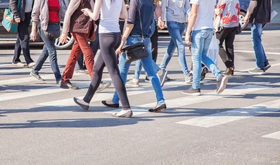 Deurstickers pedestrians walking on a crosswalk © Radnatt