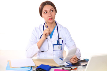 Happy smiling young beautiful female doctor showing blank area for sign or copyspace, isolated over white background