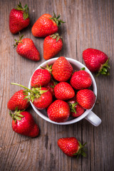 ed organic strawberries in white cup