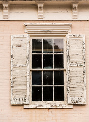 Detail of old window with peeling paint