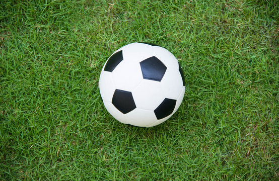 Top view of soccer ball on soccer field.