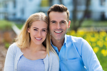 Young couple smiling outdoors