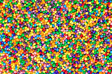 Background texture of colorful sugar candy pearls