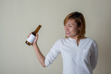 Wellness beauty woman holding a bottle of juice in her hand  gir