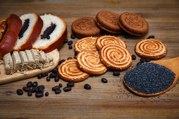 There are Pieces of Roll with Poppyseed,Cookies,Halavah Chocolate Peas,Tasty Sweet  Food on the...