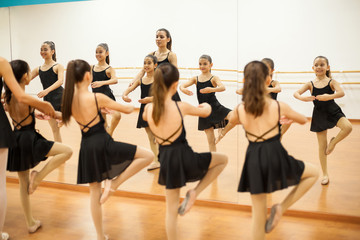 Little dancers in front of a mirror